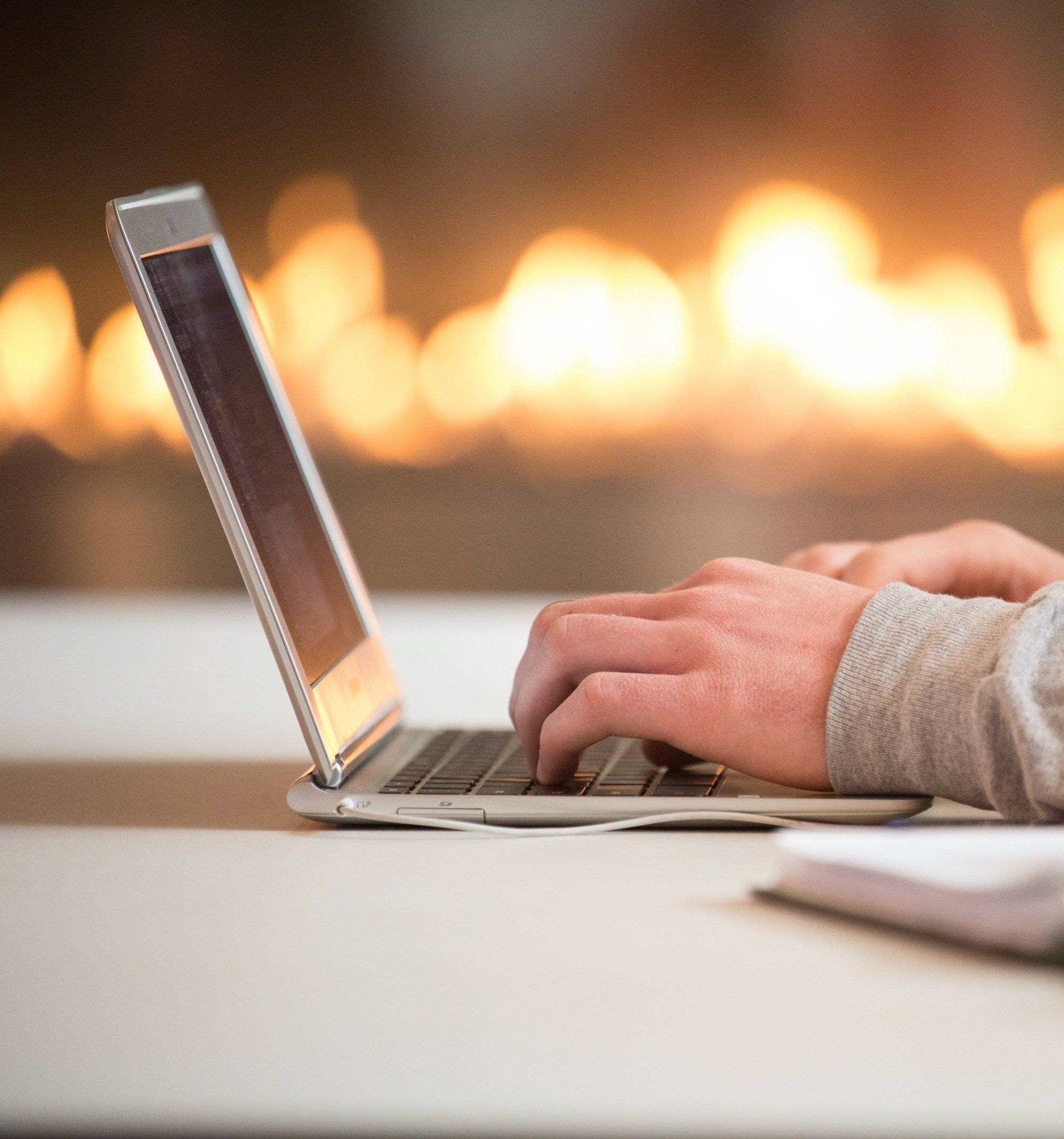 hands on a laptop keyboard